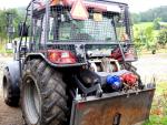 Traktor CASE s pevnou lesnickou nástavbou
